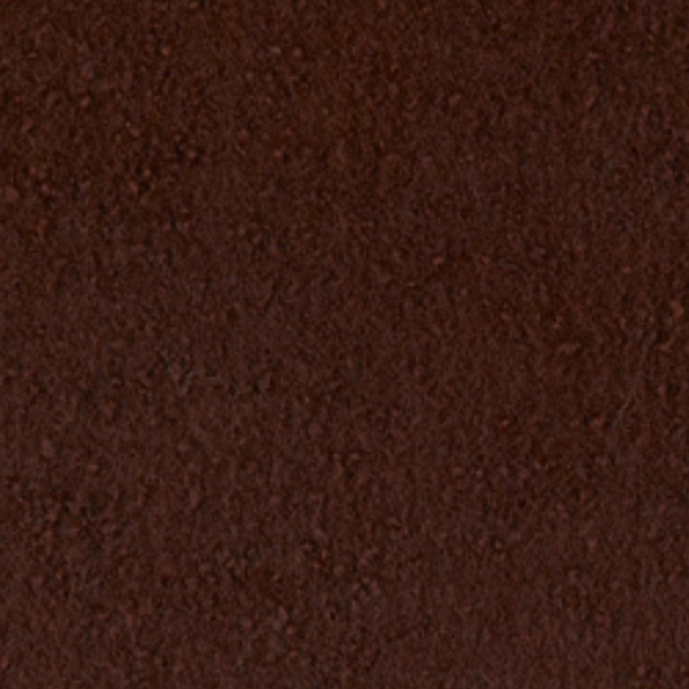 Close-up of dark oxblood boucle with dense, irregular nubby texture