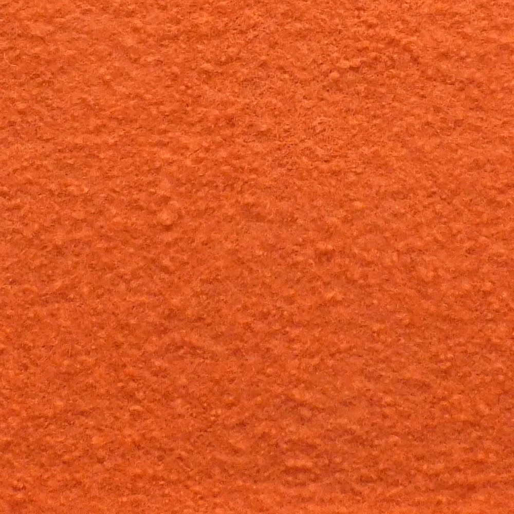 Warm peach-teracotta boucle with dense nubby texture and subtle rust variation