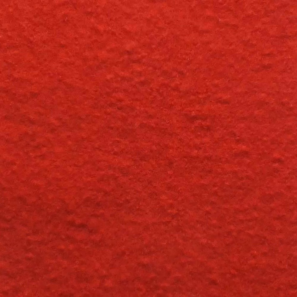 Close-up of deep scarlet red bouclé with dense, softly rippled pile texture