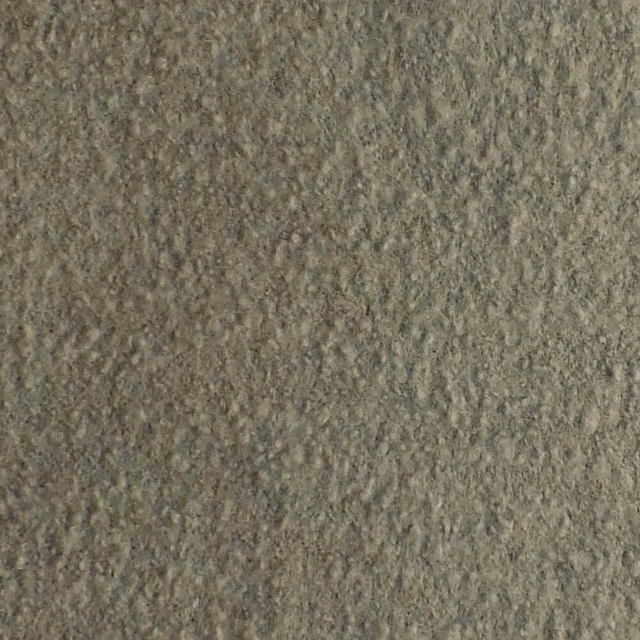 Close-up of Orkney Silver’s muted silver-grey boucle with dense, irregular nubby texture
