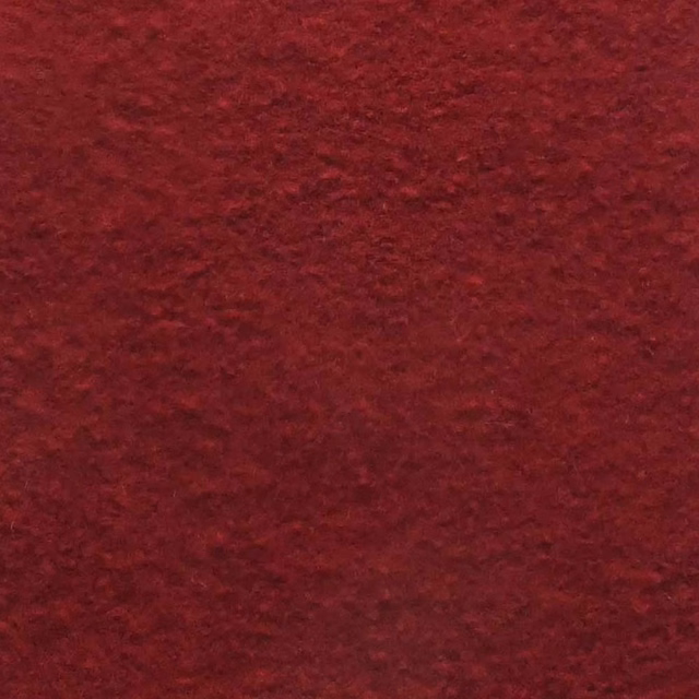 Deep zinfandel-red boucle with a dense, softly irregular tactile surface