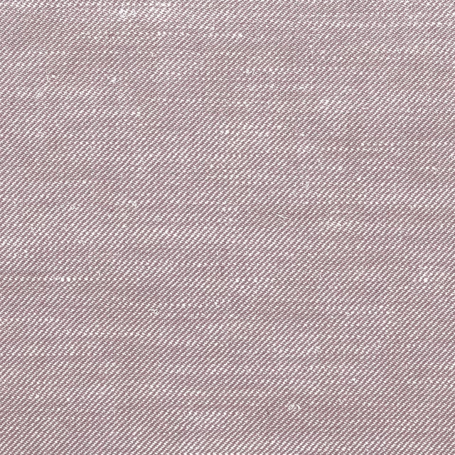 Close-up of mauve taupe fabric with a fine pale diagonal woven texture