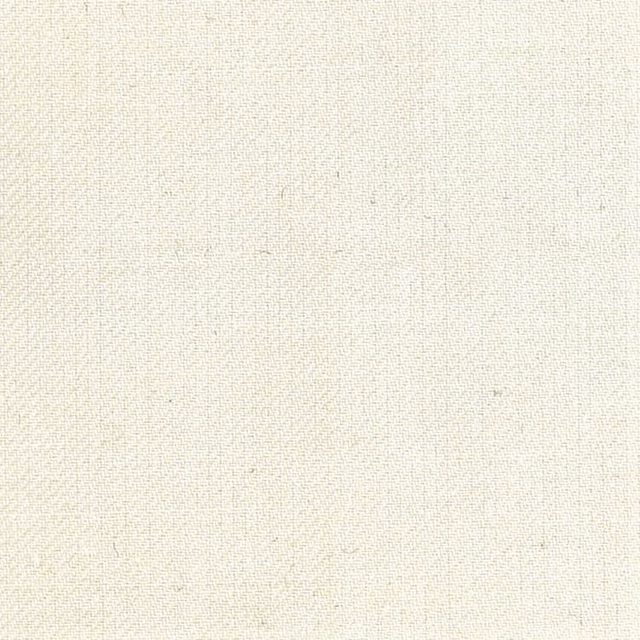 Close-up of warm ivory fabric with a fine, subtly varied woven texture