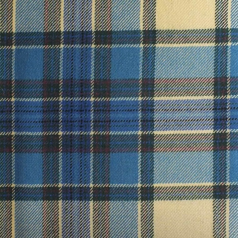 Turquoise and navy plaid fabric with cream blocks and a textured woven surface