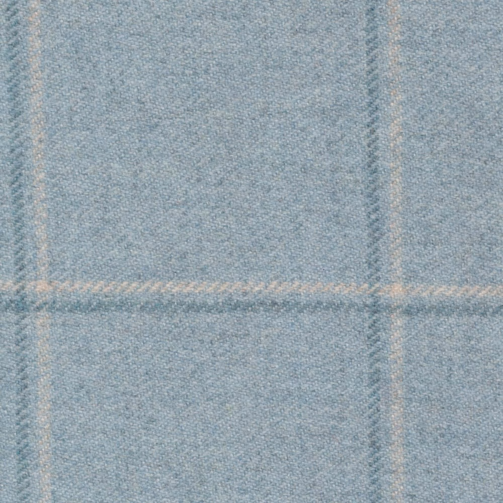 Pale blue-grey woven fabric with warm cream windowpane lines and fine textured weave