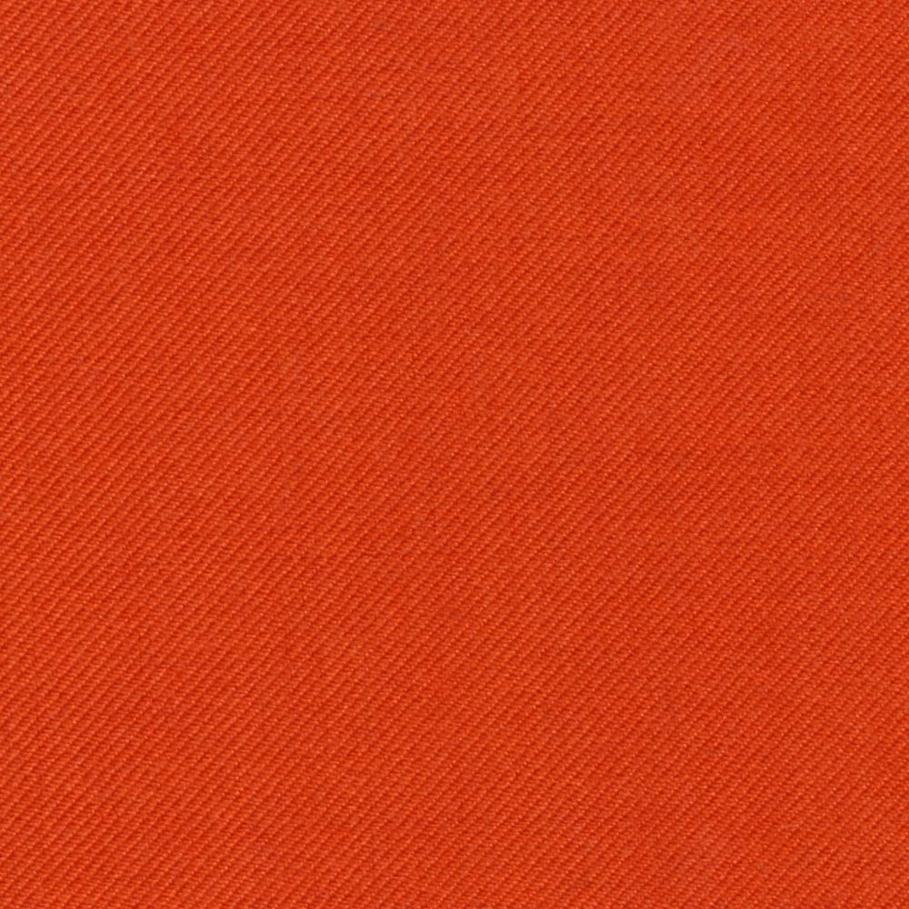 Close-up of warm brick-red fabric with a fine, even diagonal twill weave