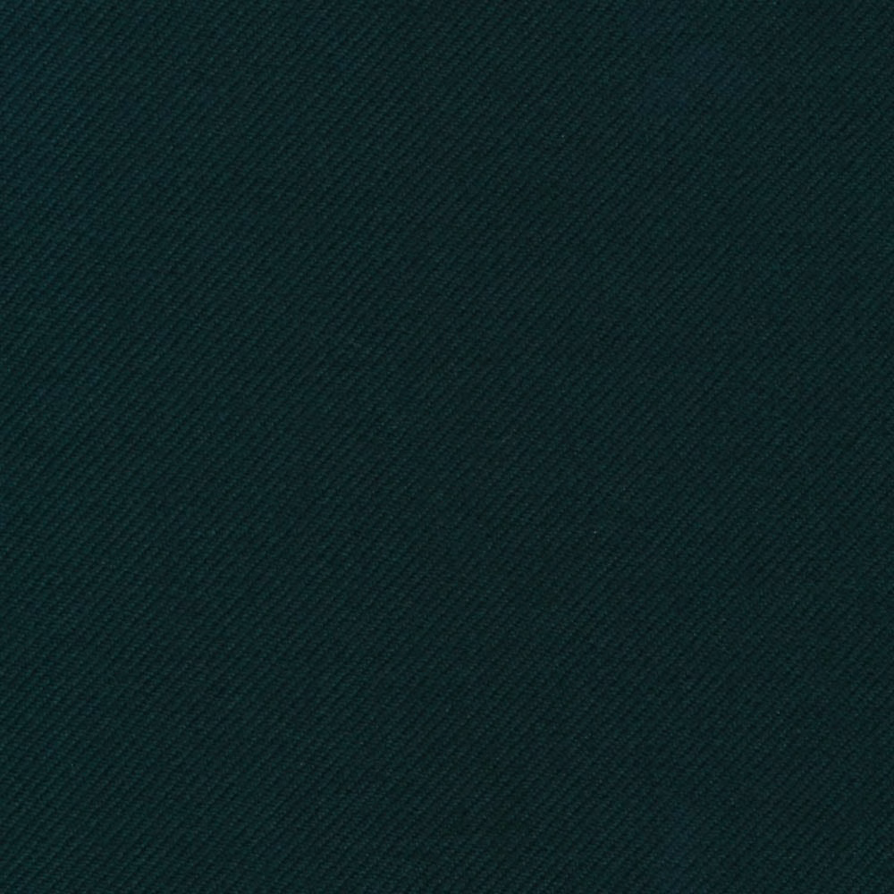 Close-up of deep pine-green fabric with a fine diagonal twill weave