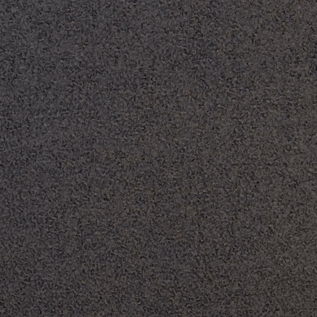 Dense dark charcoal bouclé showing softly curled graphite-grey fibres