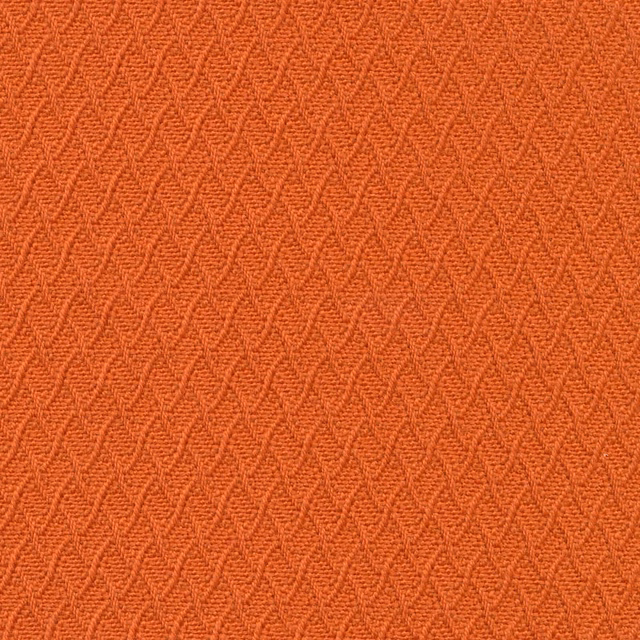 Burnt orange Waulkmill fabric with raised interlocking chevron weave