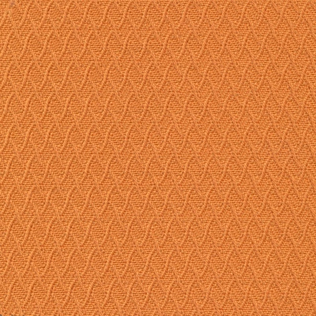 Burnished gold-orange woven swatch with a fine repeating zigzag texture