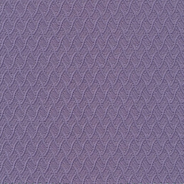 Close-up of light mauve woven fabric with raised interlocking wave lines