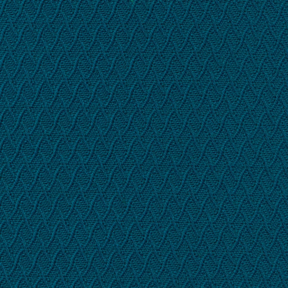 Close-up of deep teal fabric with a small raised chevron weave