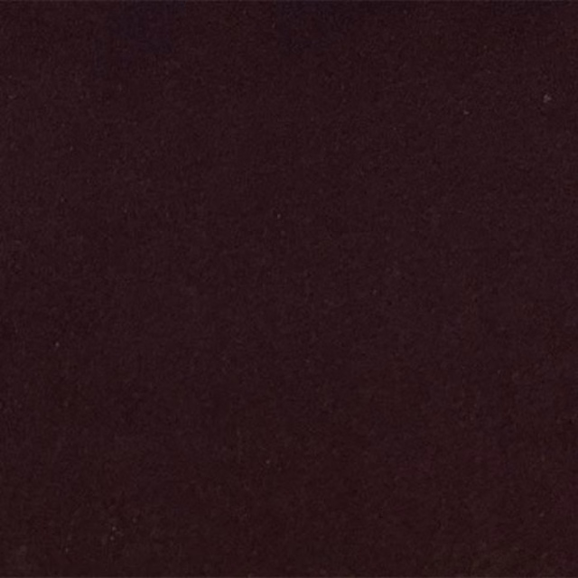 Close-up of a deep plum plain fabric swatch with a smooth, matte finish
