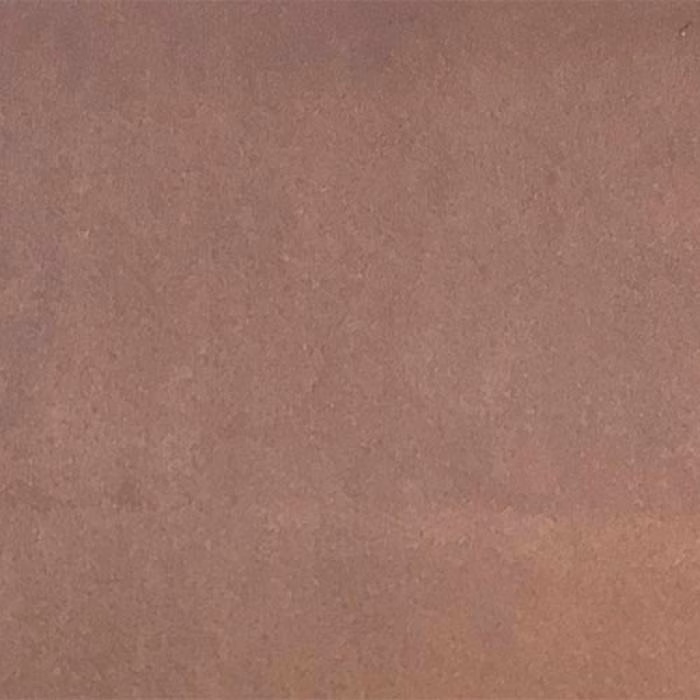 Close-up of a dusty lilac-pink plain fabric with a soft matte finish