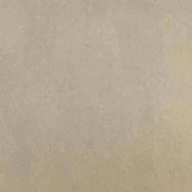 Close-up of a smooth mushroom beige plain fabric swatch