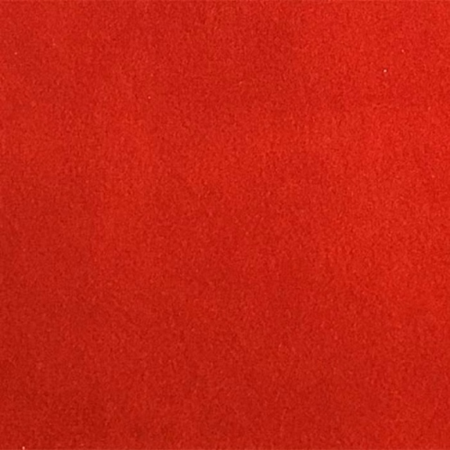 Bright pillarbox red plain fabric swatch with a soft textured finish