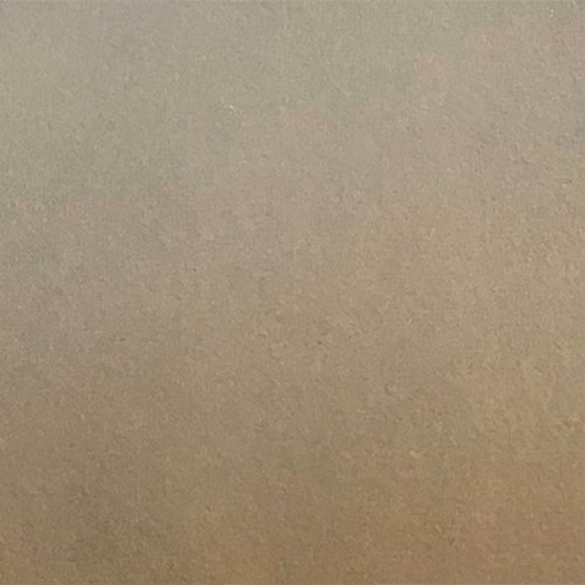 Close-up of a plain soft grey taupe fabric swatch with a smooth matte finish.