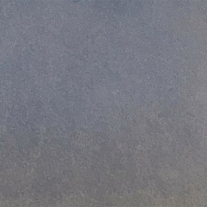 Close-up of a smooth cool blue-grey plain fabric swatch