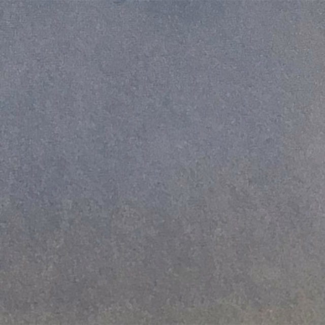 Close-up of a smooth cool blue-grey plain fabric swatch