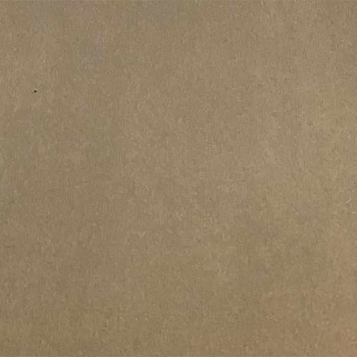 Close-up of a warm sandy beige plain fabric with a soft matte texture