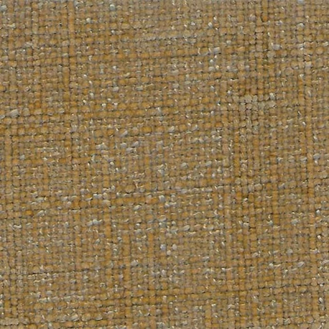 Close-up of a warm cumin-gold woven plain fabric with pale flecks and textured weave.