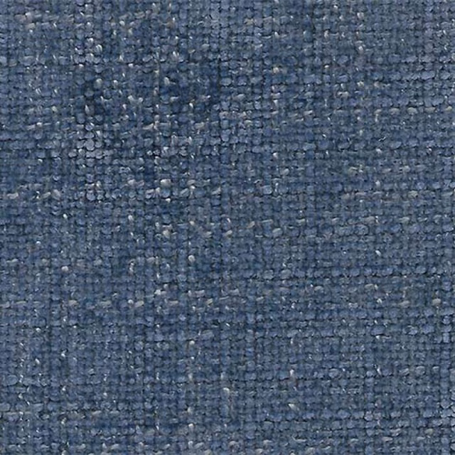 Close-up of muted denim blue plain fabric with a nubby woven texture
