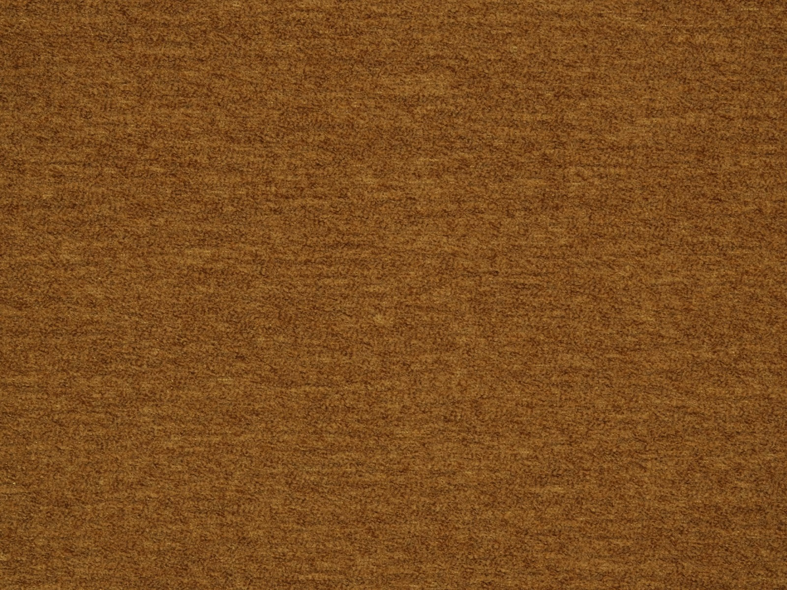 Warm caramel-brown plain fabric with a softly mottled woven texture