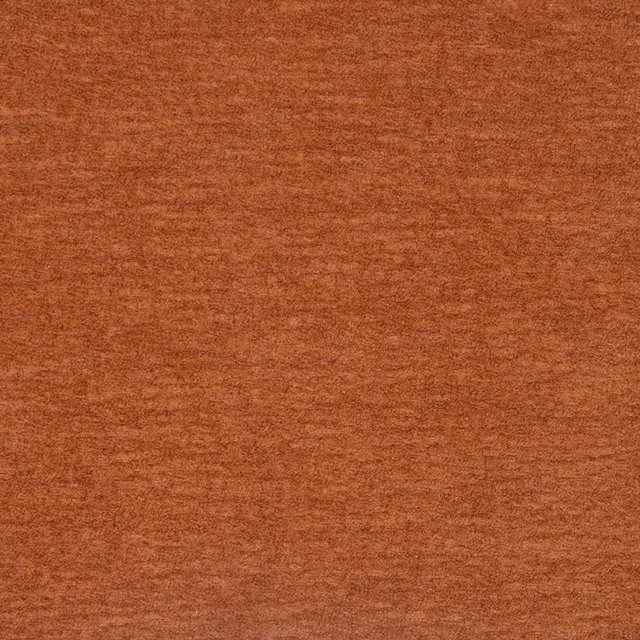 Close-up of a warm copper terracotta plain fabric with soft brushed texture