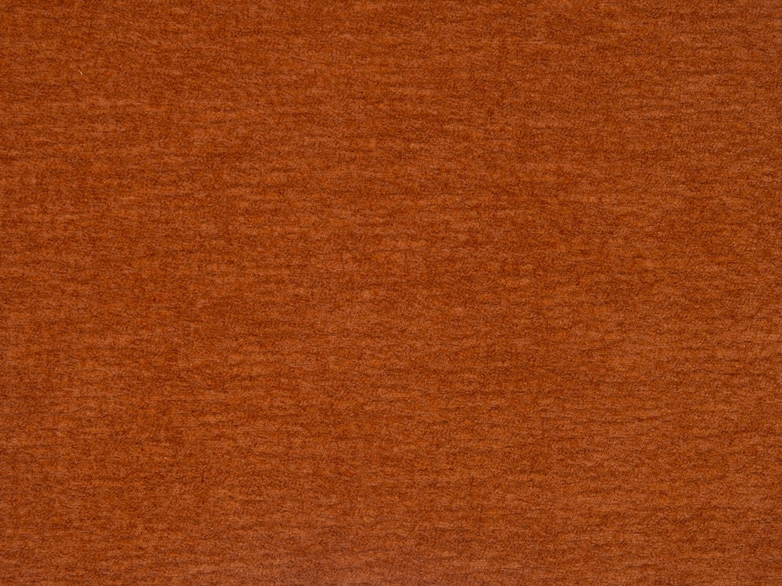 Warm copper-orange plain upholstery fabric with subtle brushed texture