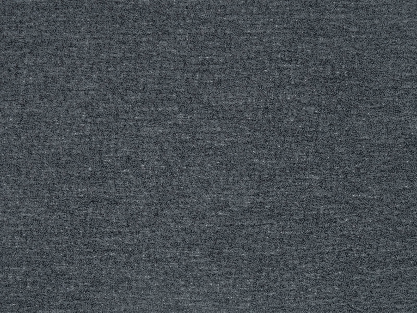 Close-up of a deep charcoal grey plain woven fabric with a subtle mottled texture