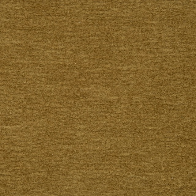Close-up of muted lemongrass gold plain fabric with fine mottled texture