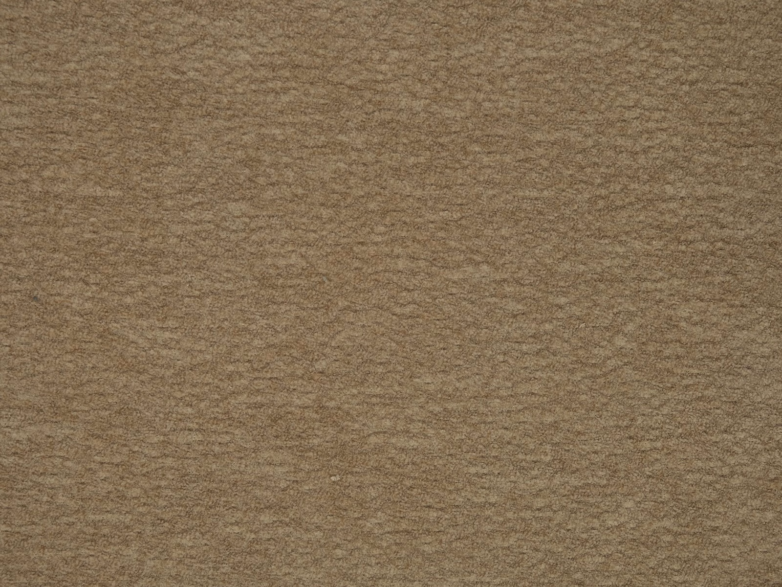 Warm mink-beige plain fabric with a softly mottled, low-pile texture
