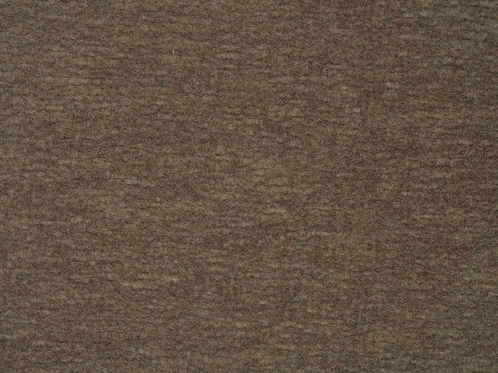 Close-up of a warm mocha brown plain fabric with subtle mottled texture