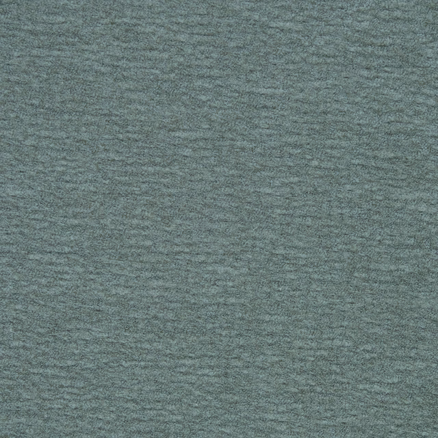 Close-up of muted sage green plain woven fabric with fine horizontal texture