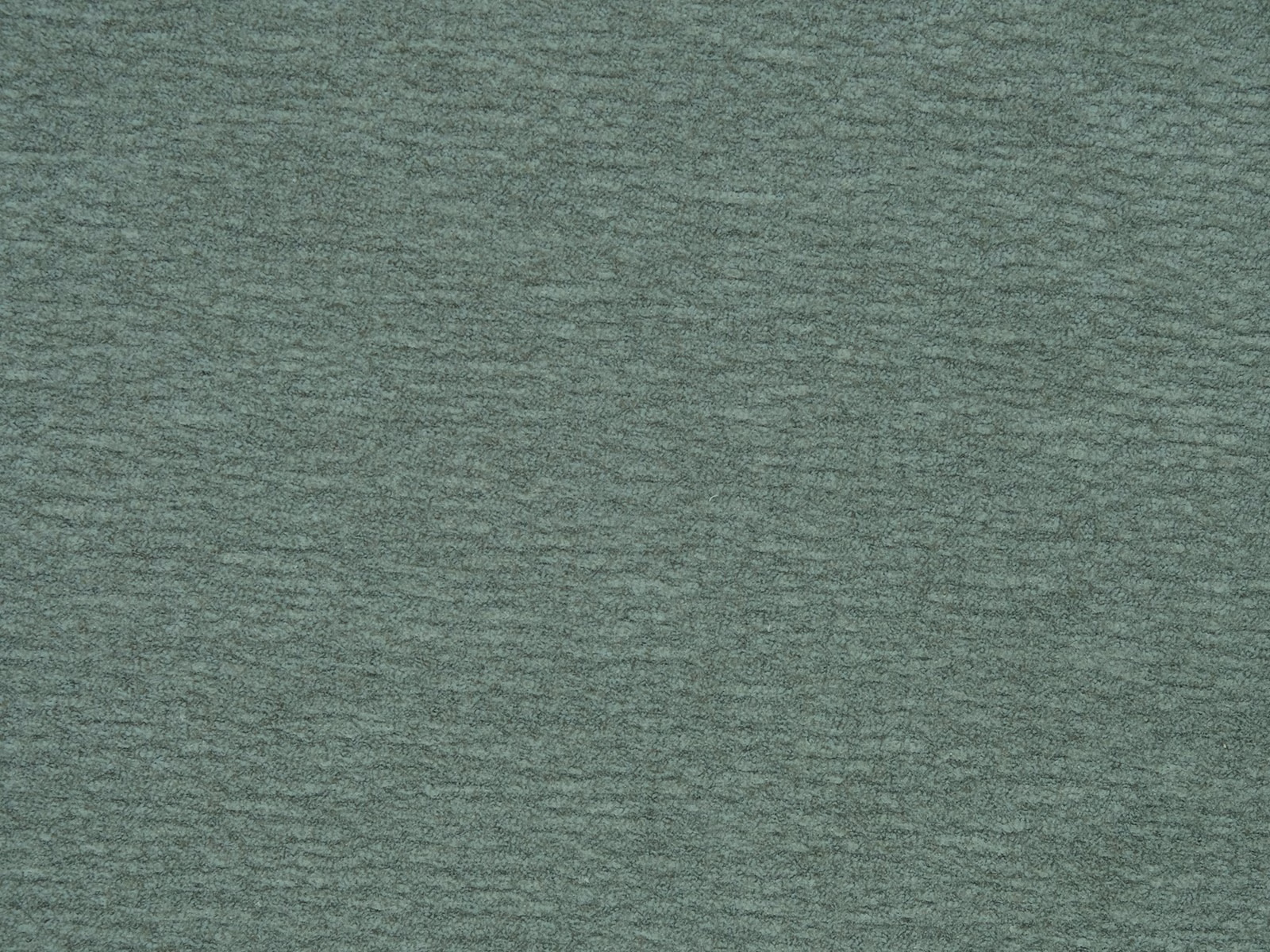Soft muted sage green plain fabric with a fine brushed texture