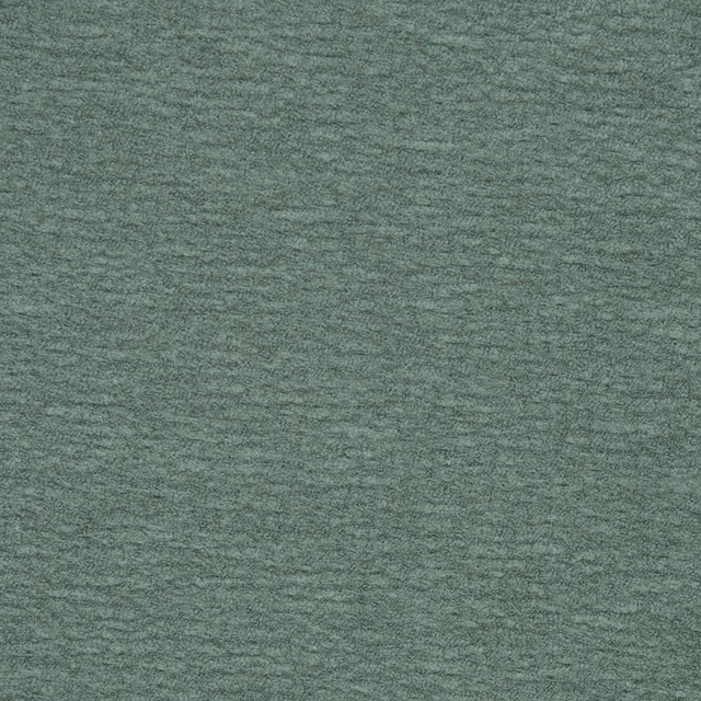 Soft muted sage green plain fabric with a fine brushed texture