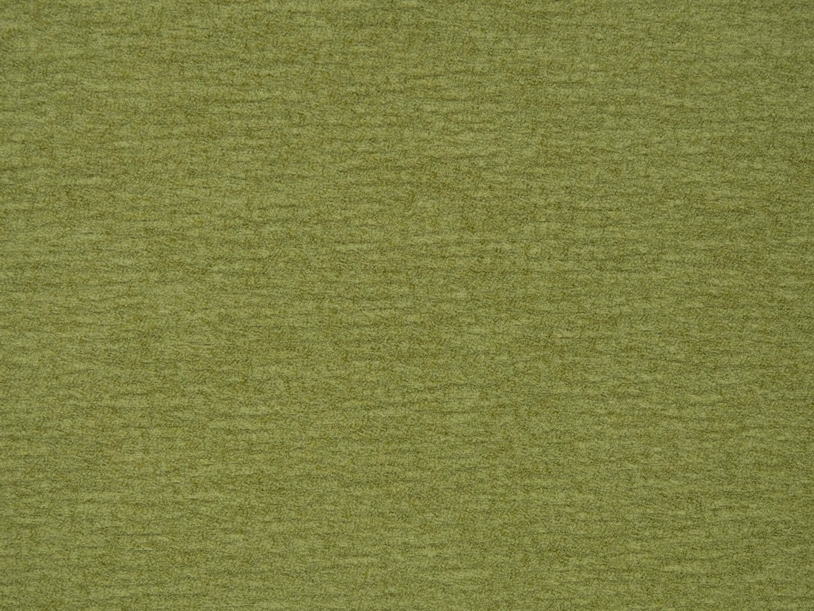 Soft pistachio green plain woven fabric with a subtle textured finish
