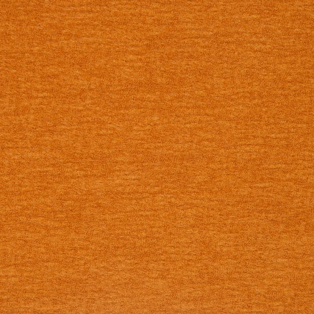 Close-up of plain pumpkin-orange fabric with a softly mottled woven texture