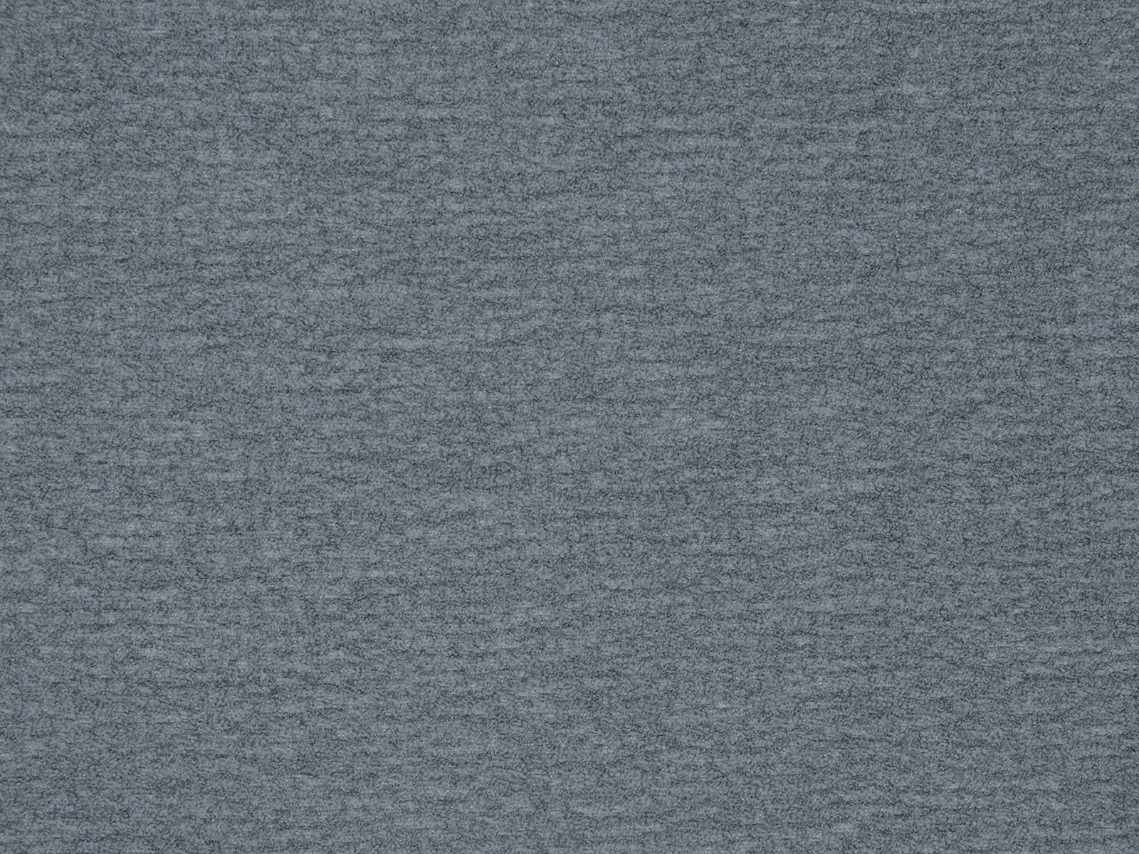 Close-up of cool slate-grey plain woven fabric with a fine mottled texture
