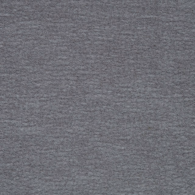 Close-up of a cool steel grey plain fabric with a softly mottled texture