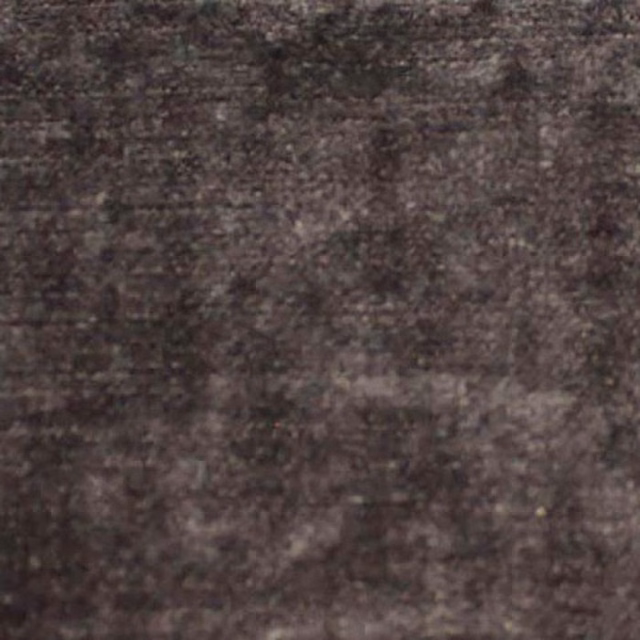 Close-up of a deep charcoal-brown plain fabric with a soft mottled texture