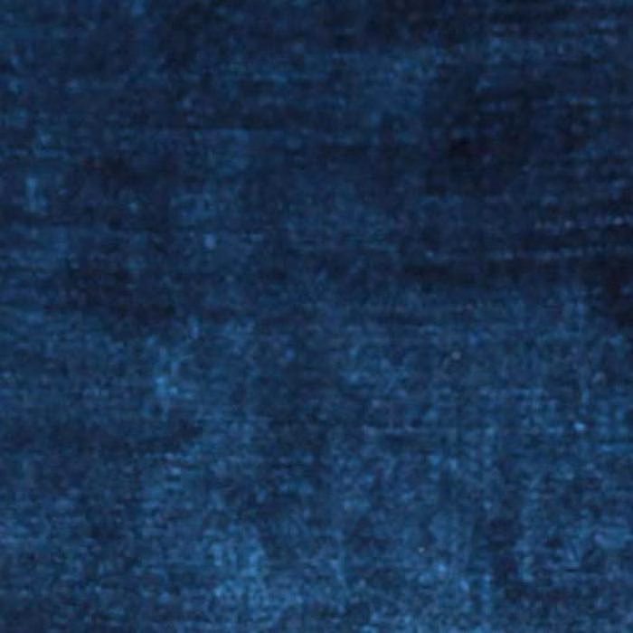 Close-up of deep mottled Delft blue plain fabric with soft velvety texture