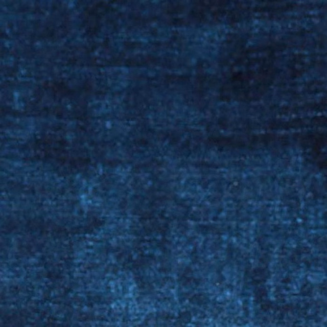 Close-up of deep mottled Delft blue plain fabric with soft velvety texture