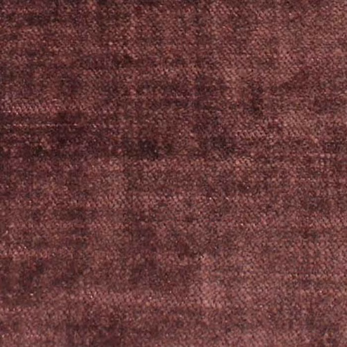 Close-up of mottled mauve plum plain weave upholstery fabric