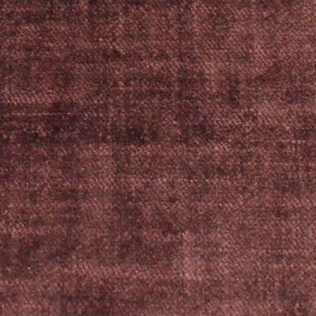 Close-up of mottled mauve plum plain weave upholstery fabric