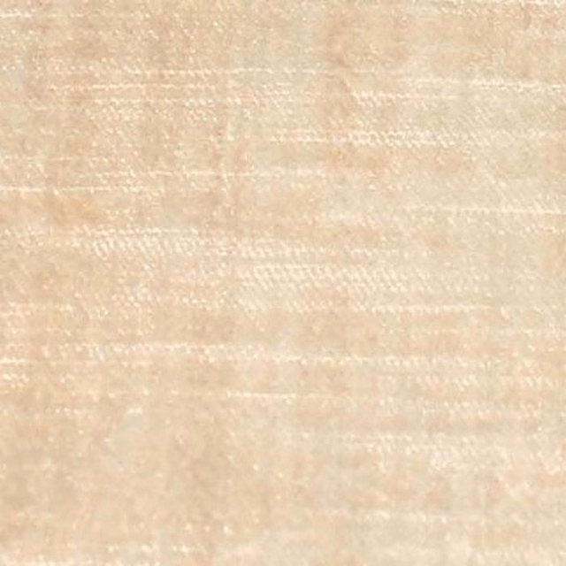 Close-up of a soft sandy beige plain fabric with subtle slub texture