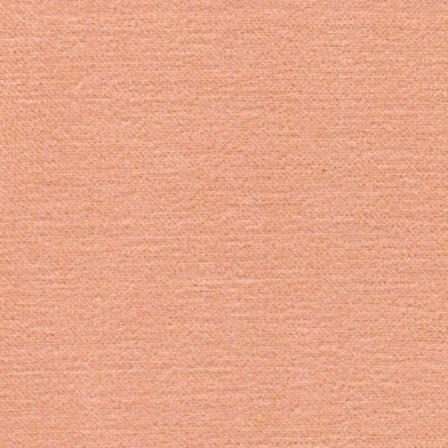 Soft blush pink plain woven fabric with a fine textured surface