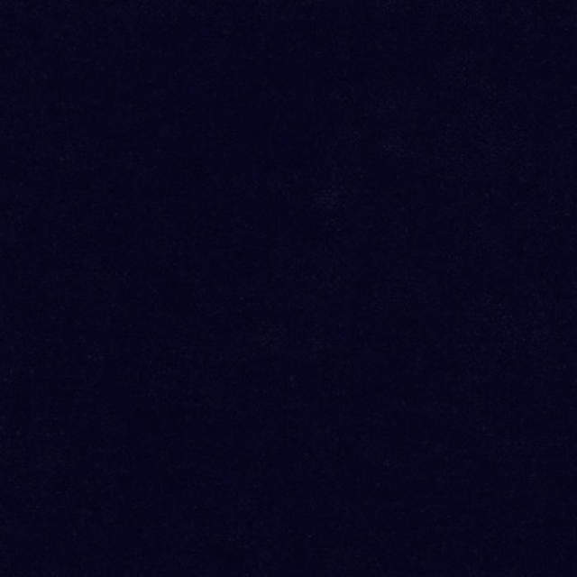 Close-up of a deep dark navy plain fabric swatch with a smooth finish