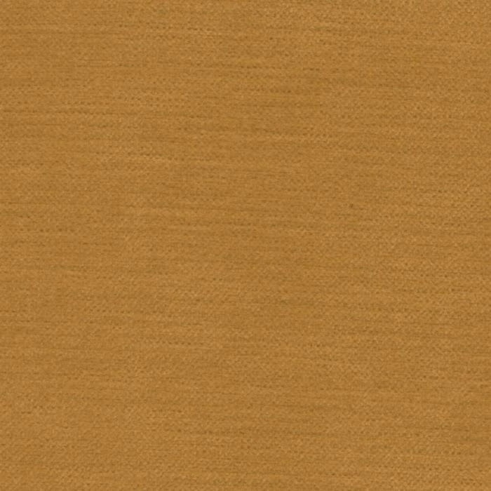 Close-up of warm old gold plain woven fabric with fine textured surface
