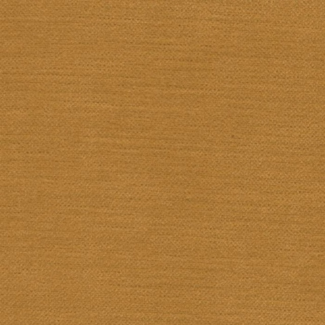Close-up of warm old gold plain woven fabric with fine textured surface